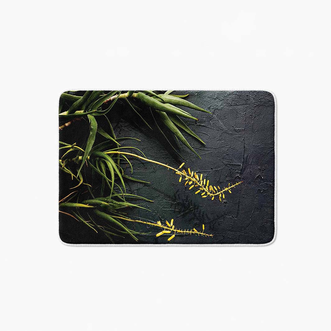 NATURAL YELLOW BLOSSOMS ALOE BUSH ON GREY BATHMAT