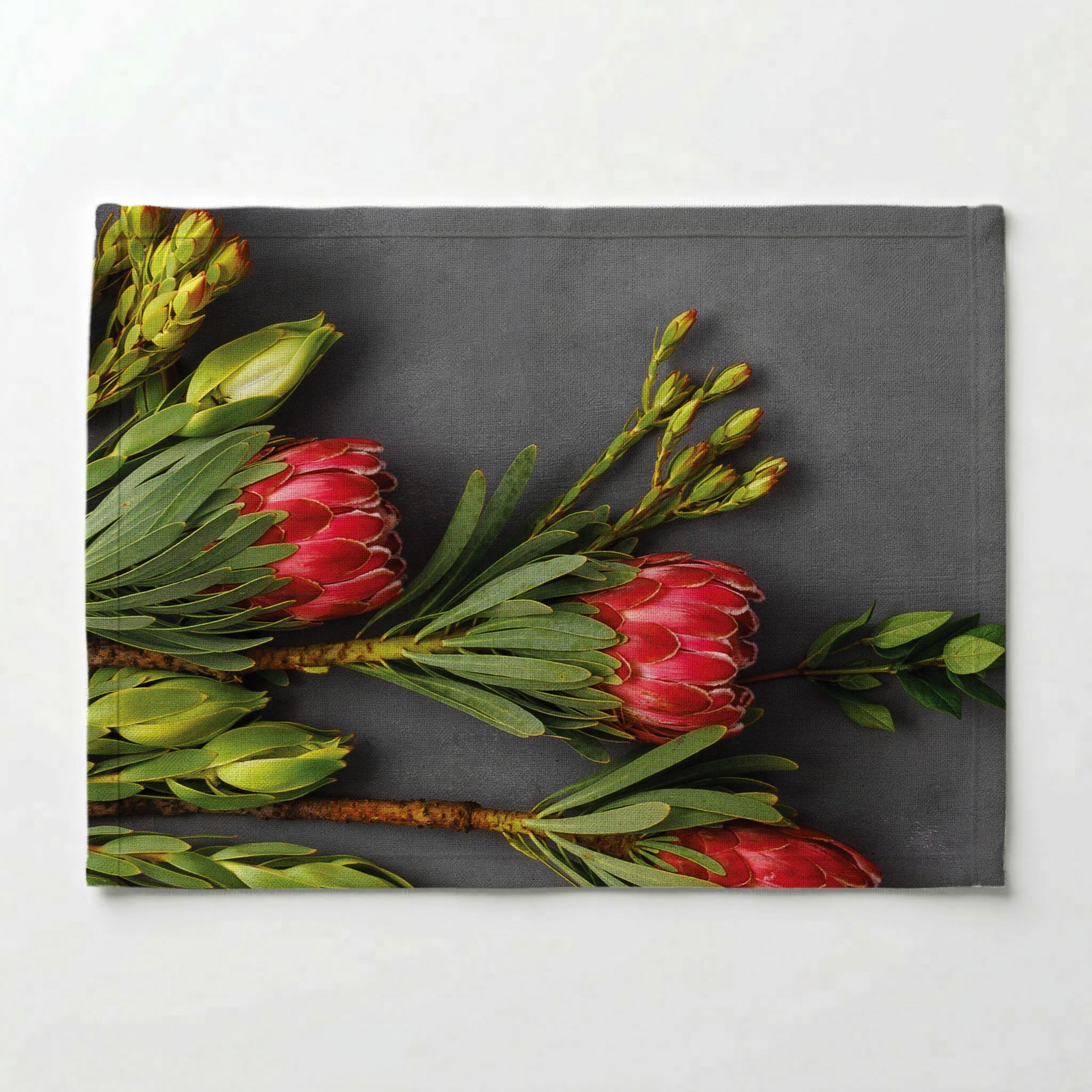 PINK PROTEAS ON GREY PLACEMAT