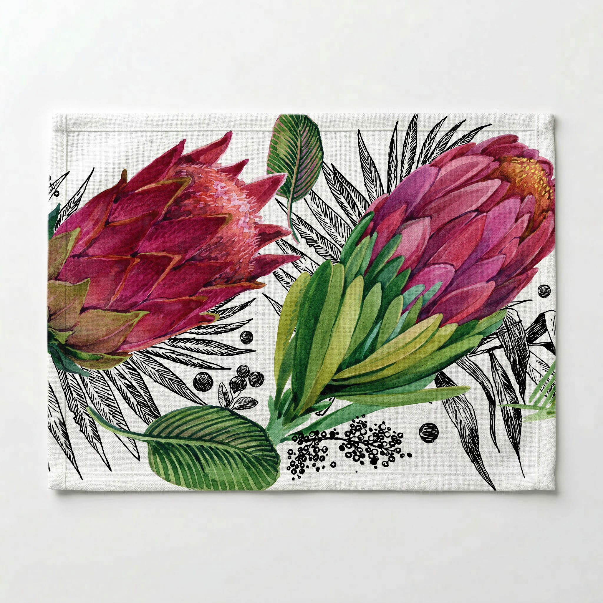 PROTEAS AND LEAVES ON WHITE PLACEMAT