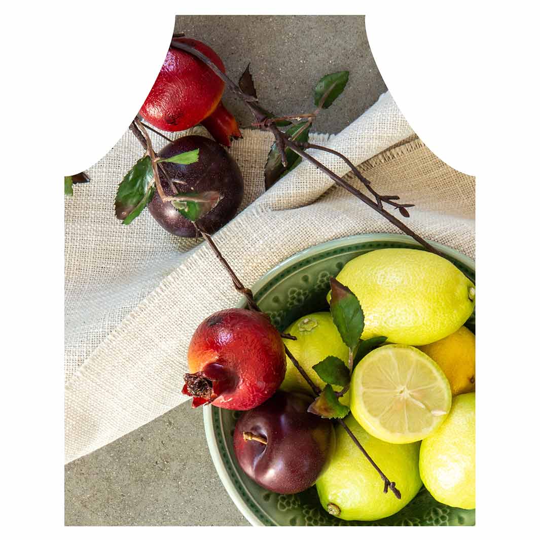 NATURAL RED POMEGRANATES AND LEMONS WITH LINEN APRON