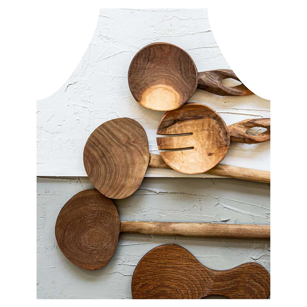 NATURAL BROWN WOODEN SPOONS ON GREY AND WHITE APRON
