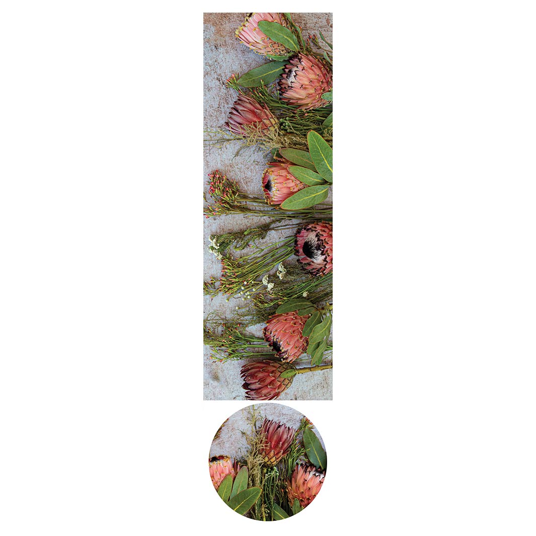 FLORAL PINK MIXED PROTEAS WITH GREEN FOLIAGE ROUND OTTOMAN