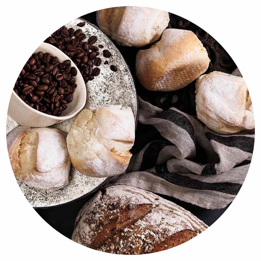 BREADS AND DRIED FRUIT ON BLACK POT STAND