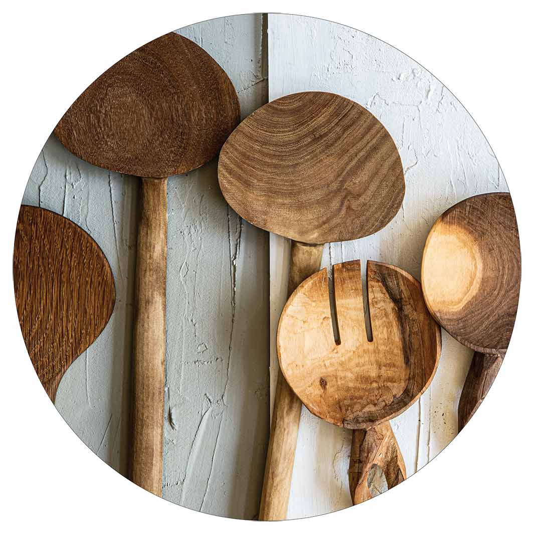 NATURAL BROWN WOODEN SPOONS ON GREY AND WHITE POT STAND