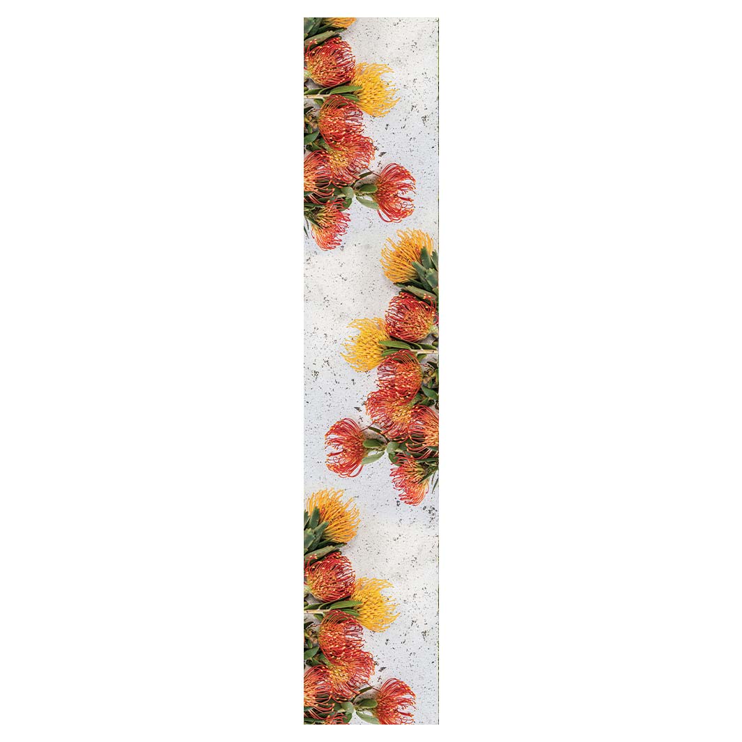 FLORAL ORANGE PIN CUSHIONS ON WHITE TABLE RUNNER