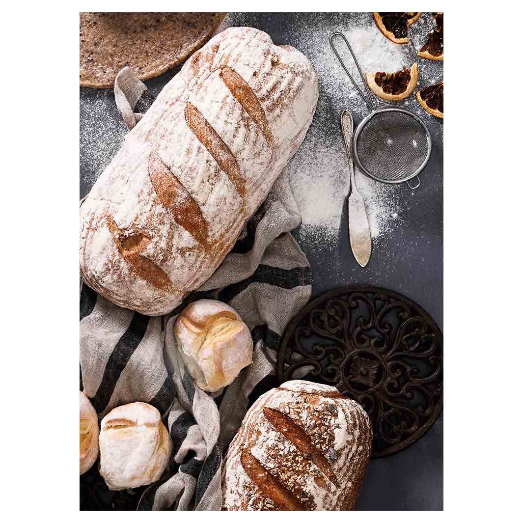BREADS AND DRIED FRUIT ON BLACK TEA TOWEL