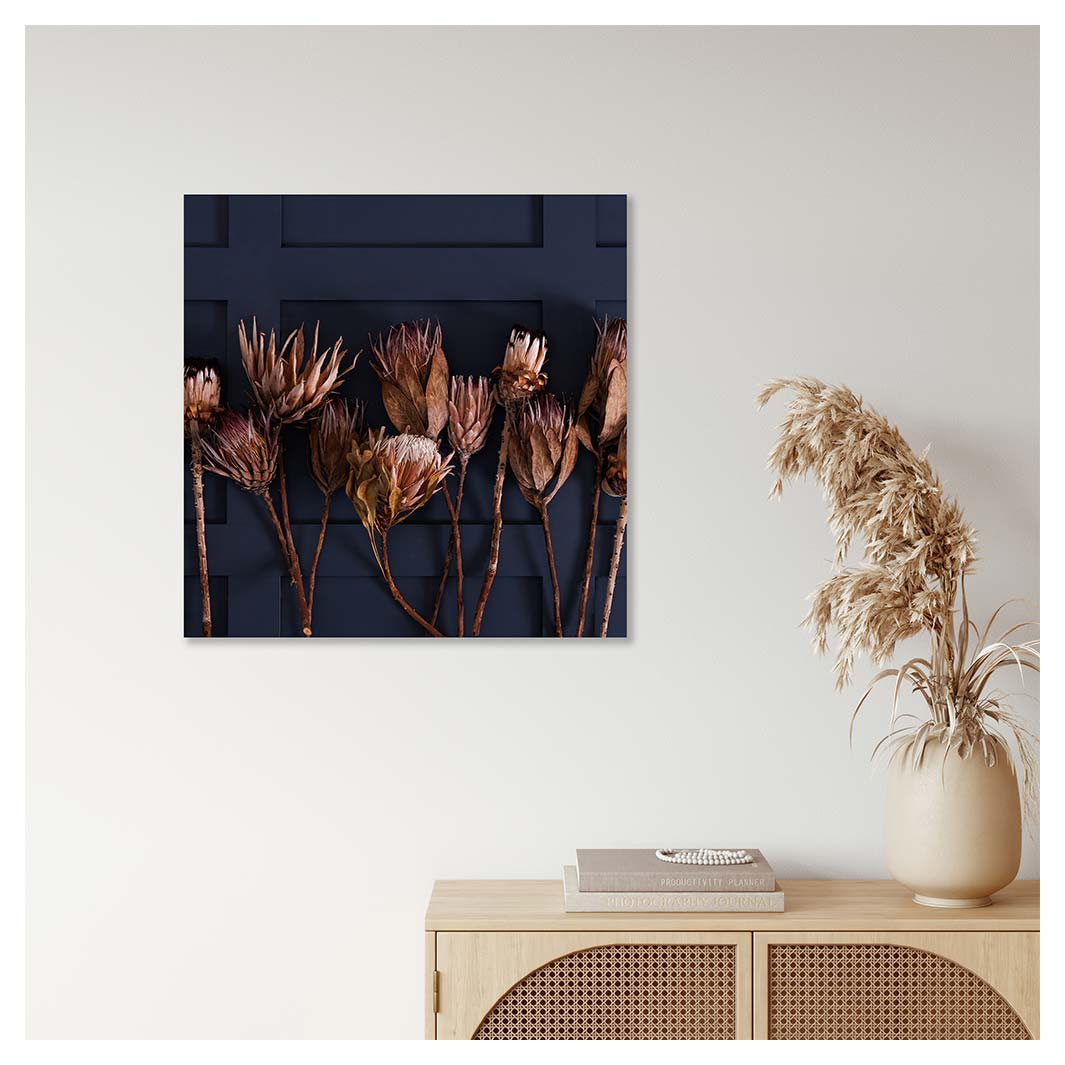 GOLDEN PROTEA ARRANGEMENT ON DARK BLUE PERSPEX