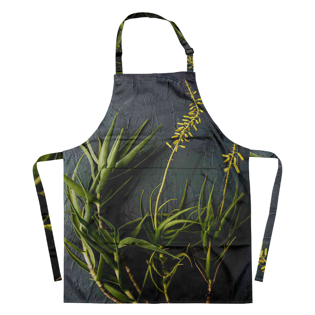 NATURAL YELLOW BLOSSOMS ALOE BUSH ON GREY APRON