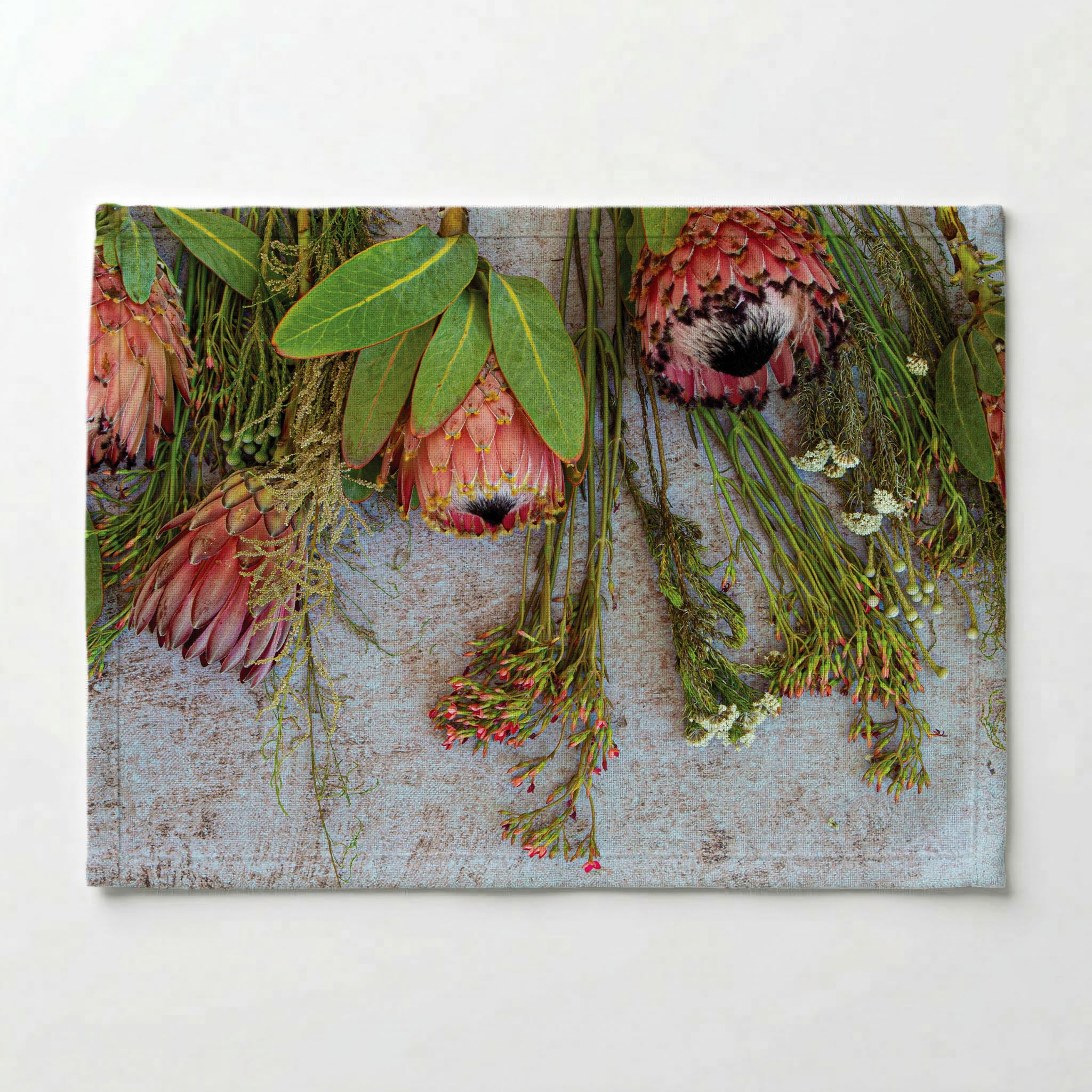 FLORAL PINK MIXED PROTEAS WITH GREEN FOLIAGE PLACEMAT