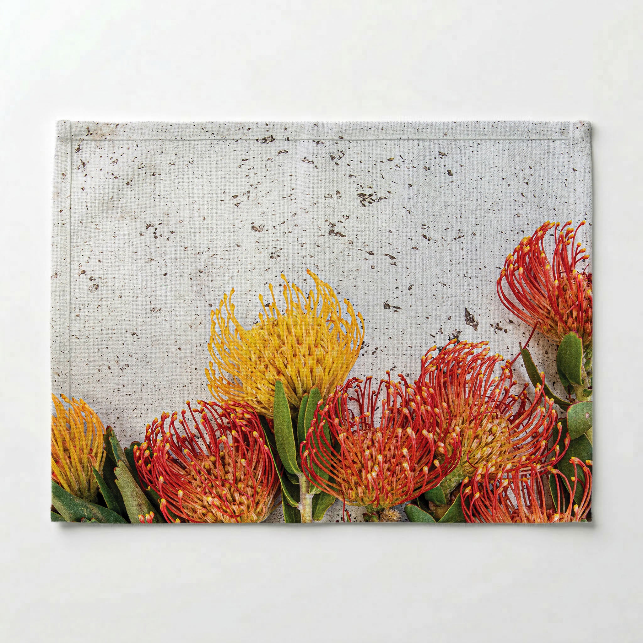 FLORAL ORANGE PIN CUSHIONS ON WHITE PLACEMAT