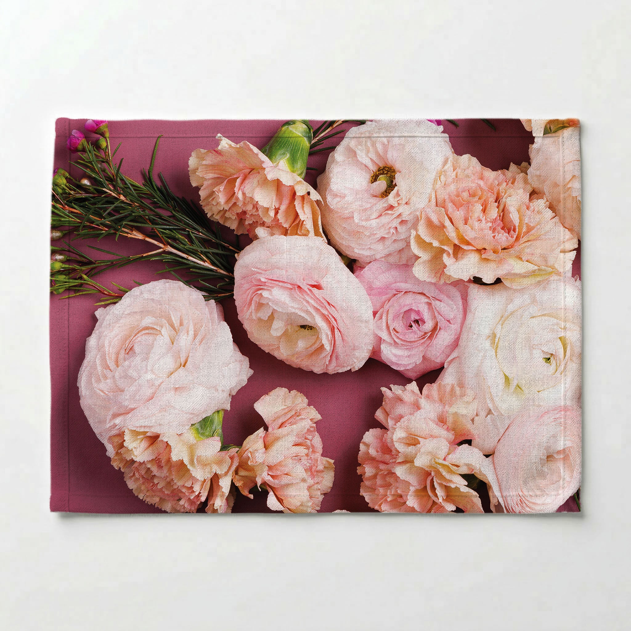 ROSES, PEONIES, AND WAX FLOWERS ON PINK PLACEMAT