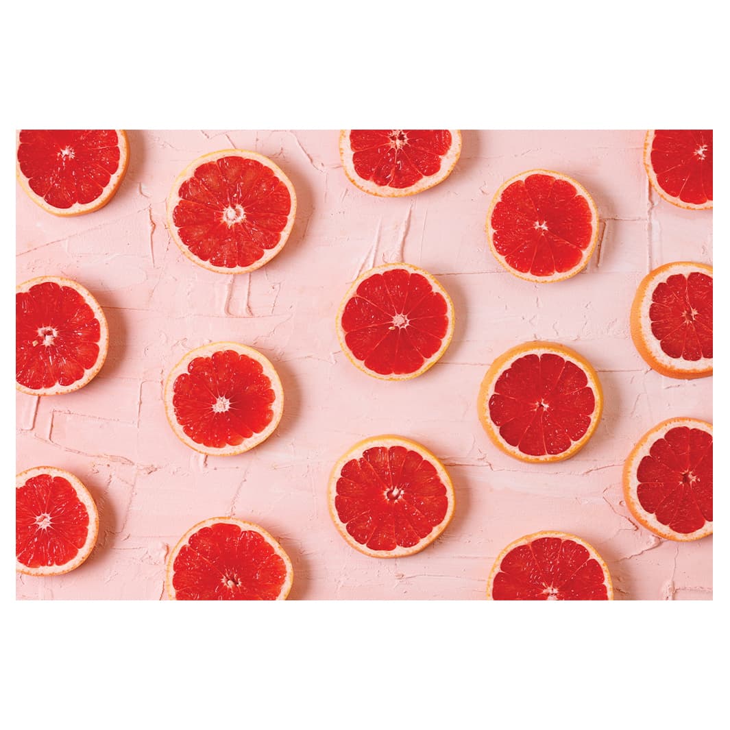 GRAPEFRUIT SLICES ON PINK RECTANGULAR RUG