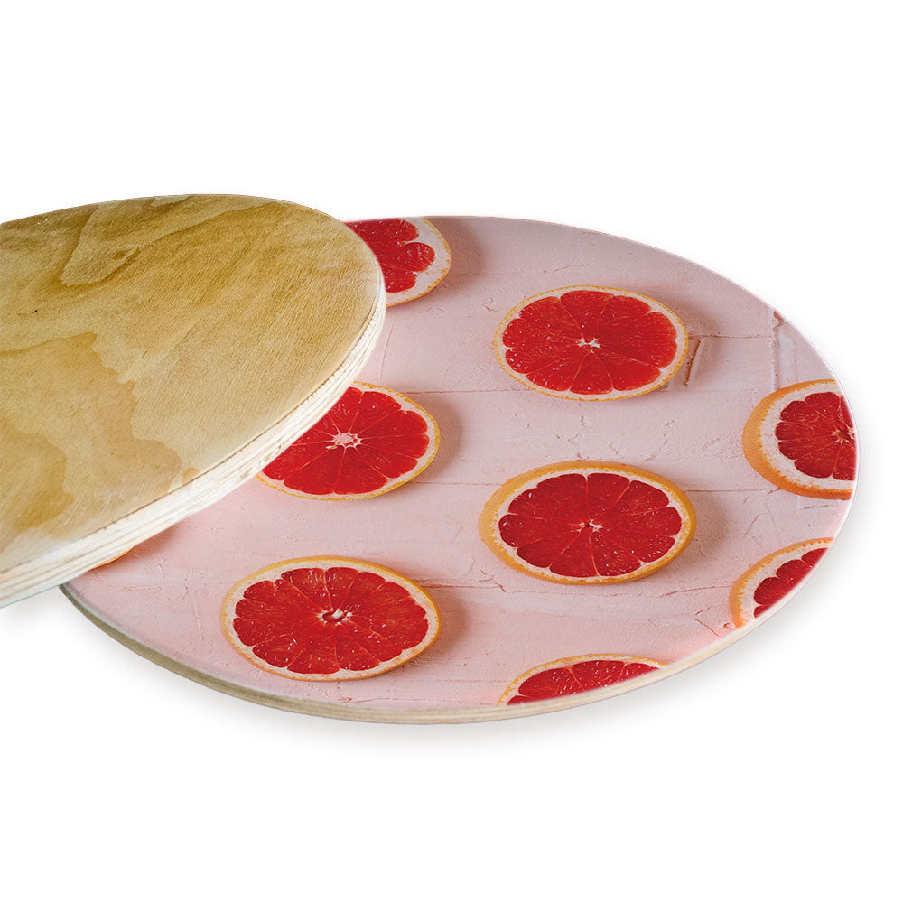 GRAPEFRUIT SLICES ON PINK CHEESEBOARD