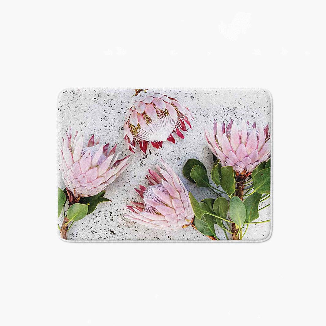 FLORAL PINK PROTEAS ON WHITE BATHMAT